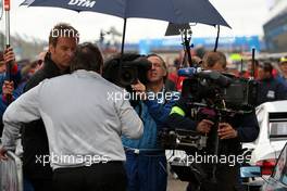 13.07.2008 Zandvoort, The Netherlands,  Norbert Haug (GER), Sporting Director Mercedes-Benz being interviewed by German television. - DTM 2008 at Circuit Park Zandvoort