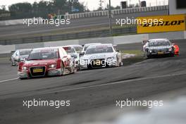27.07.2008 Nürburg, Germany,  First lap and the pack exits the Mercedes Arena. Mike Rockenfeller (GER), Audi Sport Team Rosberg, Audi A4 DTM still leads and some cars are going wide. - DTM 2008 at Nürburgring