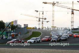 27.07.2008 Nürburg, Germany,  Start of the race. Mike Rockenfeller (GER), Audi Sport Team Rosberg, Audi A4 DTM leads. In the background a few of the huge building cranes at the new construction site. - DTM 2008 at Nürburgring
