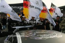 26.10.2008 Hockenheim, Germany,  Special tribute sign on the roof of the car of Bernd Schneider (GER), Team HWA AMG Mercedes, AMG Mercedes C-Klasse, with pictures of his old DTM cars. His mechanics have German flasg with the text: Bye, Bye Bernd! - DTM 2008 at Hockenheimring, Germany