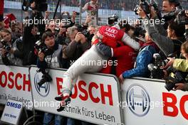26.10.2008 Hockenheim, Germany,  Timo Scheider (GER), Audi Sport Team Abt, Audi A4 DTM jumping on the barrier to greet his Audi crew. - DTM 2008 at Hockenheimring, Germany