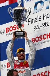 26.10.2008 Hockenheim, Germany,  Timo Scheider (GER), Audi Sport Team Abt, Audi A4 DTM with his trophy of the Hockenheim race. - DTM 2008 at Hockenheimring, Germany