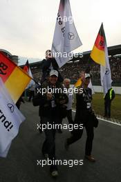 26.10.2008 Hockenheim, Germany,  Mercedes guests with German flags and T-shirts with the text: Bye, bye Bernd! - DTM 2008 at Hockenheimring, Germany