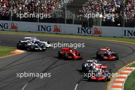 16.03.2008 Melbourne, Australia,  Start, Lewis Hamilton (GBR), McLaren Mercedes, MP4-23 leads Robert Kubica (POL), BMW Sauber F1 Team, F1.08 and Heikki Kovalainen (FIN), McLaren Mercedes, MP4-23 - Formula 1 World Championship, Rd 1, Australian Grand Prix, Sunday Race