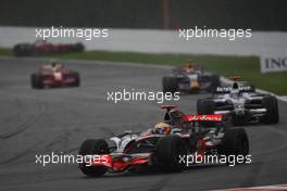 07.09.2008 Francorchamps, Belgium,  Kimi Raikkonen (FIN), Räikkönen, Scuderia Ferrari, F2008, crashed, Lewis Hamilton (GBR), McLaren Mercedes, MP4-23 leads - Formula 1 World Championship, Rd 13, Belgian Grand Prix, Sunday Race