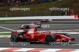07.09.2008 Francorchamps, Belgium, Kimi Raikkonen (FIN), Räikkönen, Scuderia Ferrari, F2008 leads Lewis Hamilton (GBR), McLaren Mercedes, MP4-23 - Formula 1 World Championship, Rd 13, Belgian Grand Prix, Sunday Race