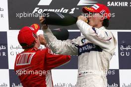 06.04.2008 Sakhir, Bahrain,  Kimi Raikkonen (FIN), Räikkönen, Scuderia Ferrari, Robert Kubica (POL), BMW Sauber F1 Team - Formula 1 World Championship, Rd 3, Bahrain Grand Prix, Sunday Podium