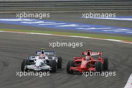 06.04.2008 Sakhir, Bahrain,  Robert Kubica (POL), BMW Sauber F1 Team, F1.08 and Kimi Raikkonen (FIN), Räikkönen, Scuderia Ferrari, F2008 - Formula 1 World Championship, Rd 3, Bahrain Grand Prix, Sunday Race