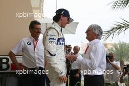 05.04.2008 Sakhir, Bahrain,  Robert Kubica (POL),  BMW Sauber F1 Team is congratulated by Bernie Ecclestone (GBR) for getting pole position - Formula 1 World Championship, Rd 3, Bahrain Grand Prix, Saturday Qualifying