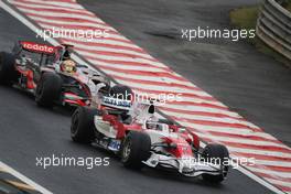 02.11.2008 Sao Paulo, Brazil,  Jarno Trulli (ITA), Toyota Racing, TF108 leads Lewis Hamilton (GBR), McLaren Mercedes, MP4-23 - Formula 1 World Championship, Rd 18, Brazilian Grand Prix, Sunday Race