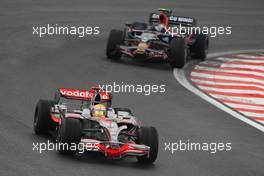 02.11.2008 Sao Paulo, Brazil,  Lewis Hamilton (GBR), McLaren Mercedes, MP4-23 and Sebastian Vettel (GER), Scuderia Toro Rosso, STR03 - Formula 1 World Championship, Rd 18, Brazilian Grand Prix, Sunday Race