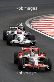 02.11.2008 Sao Paulo, Brazil,  Adrian Sutil (GER), Force India F1 Team, VJM-01 leads Robert Kubica (POL), BMW Sauber F1 Team, F1.08 - Formula 1 World Championship, Rd 18, Brazilian Grand Prix, Sunday Race