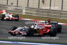 19.10.2008 Shanghai, China,  Adrian Sutil (GER), Force India F1 Team, VJM-01 leads Sebastian Bourdais (FRA), Scuderia Toro Rosso, STR03 - Formula 1 World Championship, Rd 17, Chinese Grand Prix, Sunday Race
