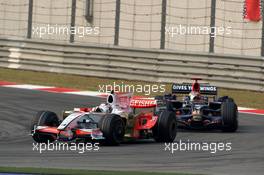 19.10.2008 Shanghai, China,  Adrian Sutil (GER), Force India F1 Team leads Sebastian Bourdais (FRA), Scuderia Toro Rosso - Formula 1 World Championship, Rd 17, Chinese Grand Prix, Sunday Race