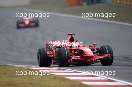19.10.2008 Shanghai, China,  Kimi Raikkonen (FIN), Räikkönen, Scuderia Ferrari, F2008 leads Felipe Massa (BRA), Scuderia Ferrari, F2008 - Formula 1 World Championship, Rd 17, Chinese Grand Prix, Sunday Race
