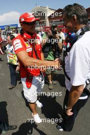 24.08.2008 Valencia, Spain,  Michael Schumacher (GER), Test Driver, Scuderia Ferrari and Dr. Mario Theissen (GER), BMW Sauber F1 Team, BMW Motorsport Director - Formula 1 World Championship, Rd 12, European Grand Prix, Sunday Pre-Race Grid