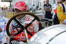 20.06.2008 Magny Cours, France,  Heikki Kovalainen (FIN), McLaren Mercedes and a 1908 historic Benz Grand Prix car - Formula 1 World Championship, Rd 8, French Grand Prix, Friday