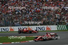 22.06.2008 Magny Cours, France,  Kimi Raikkonen (FIN), Räikkönen, Scuderia Ferrari, F2008 leads Felipe Massa (BRA), Scuderia Ferrari, F2008 - Formula 1 World Championship, Rd 8, French Grand Prix, Sunday Race