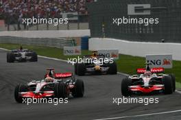 22.06.2008 Magny Cours, France,  Lewis Hamilton (GBR), McLaren Mercedes, MP4-23 and Heikki Kovalainen (FIN), McLaren Mercedes, MP4-23 - Formula 1 World Championship, Rd 8, French Grand Prix, Sunday Race