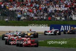 22.06.2008 Magny Cours, France,  Start, Kimi Raikkonen (FIN), Räikkönen, Scuderia Ferrari, F2008 leads Felipe Massa (BRA), Scuderia Ferrari, F2008 - Formula 1 World Championship, Rd 8, French Grand Prix, Sunday Race