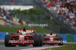 22.06.2008 Magny Cours, France,  Felipe Massa (BRA), Scuderia Ferrari, F2008 and Kimi Raikkonen (FIN), Räikkönen, Scuderia Ferrari, F2008 - Formula 1 World Championship, Rd 8, French Grand Prix, Sunday Race