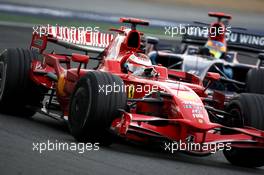 22.06.2008 Magny Cours, France,  Kimi Raikkonen (FIN), Räikkönen, Scuderia Ferrari leads Sebastian Bourdais (FRA), Scuderia Toro Rosso - Formula 1 World Championship, Rd 8, French Grand Prix, Sunday Race