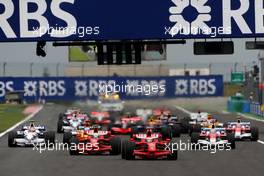 22.06.2008 Magny Cours, France,  Start, Kimi Raikkonen (FIN), Räikkönen, Scuderia Ferrari, F2008 leads Felipe Massa (BRA), Scuderia Ferrari, F2008 - Formula 1 World Championship, Rd 8, French Grand Prix, Sunday Race