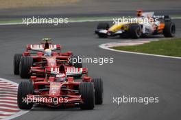 22.06.2008 Magny Cours, France,  Kimi Raikkonen (FIN), Räikkönen, Scuderia Ferrari, F2008 leads, Felipe Massa (BRA), Scuderia Ferrari, F2008 - Formula 1 World Championship, Rd 8, French Grand Prix, Sunday Race