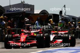 21.06.2008 Magny Cours, France,  Kimi Raikkonen (FIN), Räikkönen, Scuderia Ferrari, F2008 followed by Lewis Hamilton (GBR), McLaren Mercedes, MP4-23 - Formula 1 World Championship, Rd 8, French Grand Prix, Saturday Qualifying