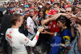 19.06.2008 Magny Cours, France,  Sebastian Bourdais (FRA), Scuderia Toro Rosso signs autographs - Formula 1 World Championship, Rd 8, French Grand Prix, Thursday