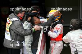 06.07.2008 Silverstone, England,  Lewis Hamilton (GBR), McLaren Mercedes and his brother - Formula 1 World Championship, Rd 9, British Grand Prix, Sunday Podium