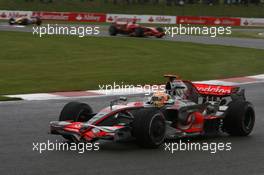 06.07.2008 Silverstone, England,  Lewis Hamilton (GBR), McLaren Mercedes, MP4-23 and Kimi Raikkonen (FIN), Räikkönen, Scuderia Ferrari, F2008 - Formula 1 World Championship, Rd 9, British Grand Prix, Sunday Race