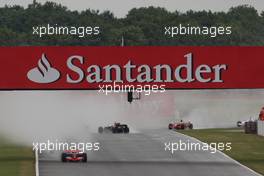 06.07.2008 Silverstone, England,  Heikki Kovalainen (FIN), McLaren Mercedes, MP4-23 leads, Mark Webber (AUS), Red Bull Racing, RB4 spins - Formula 1 World Championship, Rd 9, British Grand Prix, Sunday Race