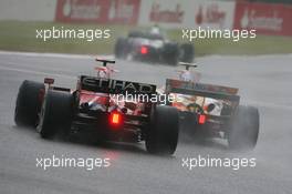 06.07.2008 Silverstone, England,  Kimi Raikkonen (FIN), Räikkönen, Scuderia Ferrari, F2008 and Nelson Piquet Jr (BRA), Renault F1 Team, R28 - Formula 1 World Championship, Rd 9, British Grand Prix, Sunday Race