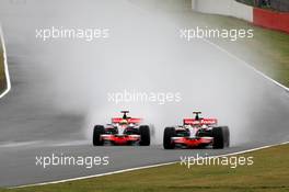 06.07.2008 Silverstone, England,  Lewis Hamilton (GBR), McLaren Mercedes overtakes Heikki Kovalainen (FIN), McLaren Mercedes - Formula 1 World Championship, Rd 9, British Grand Prix, Sunday Race