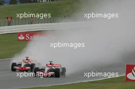 06.07.2008 Silverstone, England,  Heikki Kovalainen (FIN), McLaren Mercedes, MP4-23 and Lewis Hamilton (GBR), McLaren Mercedes, MP4-23 - Formula 1 World Championship, Rd 9, British Grand Prix, Sunday Race