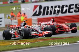 06.07.2008 Silverstone, England,  Heikki Kovalainen (FIN), McLaren Mercedes, MP4-23 and Kimi Raikkonen (FIN), Räikkönen, Scuderia Ferrari, F2008 - Formula 1 World Championship, Rd 9, British Grand Prix, Sunday Race