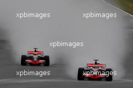 06.07.2008 Silverstone, England,  Heikki Kovalainen (FIN), McLaren Mercedes, MP4-23 leads Lewis Hamilton (GBR), McLaren Mercedes, MP4-23 - Formula 1 World Championship, Rd 9, British Grand Prix, Sunday Race
