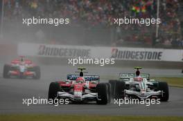 06.07.2008 Silverstone, England,  Timo Glock (GER), Toyota F1 Team, TF108 leads Rubens Barrichello (BRA), Honda Racing F1 Team - Formula 1 World Championship, Rd 9, British Grand Prix, Sunday Race