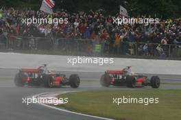 06.07.2008 Silverstone, England,  Lewis Hamilton (GBR), McLaren Mercedes, MP4-23 leads Heikki Kovalainen (FIN), McLaren Mercedes, MP4-23 - Formula 1 World Championship, Rd 9, British Grand Prix, Sunday Race