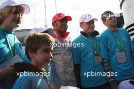 05.07.2008 Silverstone, England,  Lewis Hamilton (GBR), McLaren Mercedes with some Children - Formula 1 World Championship, Rd 9, British Grand Prix, Saturday