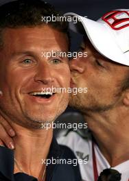 03.07.2008 Silverstone, England,  Jenson Button (GBR), Honda Racing F1 Team kisses David Coulthard (GBR), Red Bull Racing - Formula 1 World Championship, Rd 9, British Grand Prix, Thursday