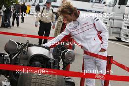 03.07.2008 Silverstone, England,  Jarno Trulli (ITA), Toyota Racing, looks at the batpod - Formula 1 World Championship, Rd 9, British Grand Prix, Thursday