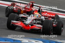 20.07.2008 Hockenheim, Germany,  Lewis Hamilton (GBR), McLaren Mercedes, MP4-23 leads Kimi Raikkonen (FIN), Räikkönen, Scuderia Ferrari, F2008 - Formula 1 World Championship, Rd 10, German Grand Prix, Sunday Race