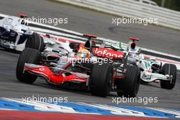 20.07.2008 Hockenheim, Germany,  Lewis Hamilton (GBR), McLaren Mercedes, MP4-23 leads Rubens Barrichello (BRA), Honda Racing F1 Team, RA108 - Formula 1 World Championship, Rd 10, German Grand Prix, Sunday Race