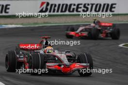 20.07.2008 Hockenheim, Germany,  Lewis Hamilton (GBR), McLaren Mercedes, MP4-23 leads Heikki Kovalainen (FIN), McLaren Mercedes, MP4-23 - Formula 1 World Championship, Rd 10, German Grand Prix, Sunday Race