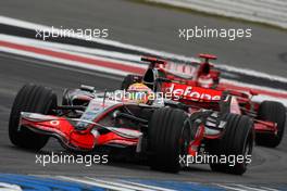 20.07.2008 Hockenheim, Germany,  Lewis Hamilton (GBR), McLaren Mercedes, MP4-23 leads Kimi Raikkonen (FIN), Räikkönen, Scuderia Ferrari, F2008 - Formula 1 World Championship, Rd 10, German Grand Prix, Sunday Race