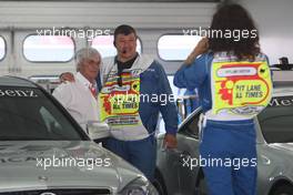 19.07.2008 Hockenheim, Germany,  Bernie Ecclestone (GBR), President and CEO of Formula One Management with some Marshalls - Formula 1 World Championship, Rd 10, German Grand Prix, Saturday