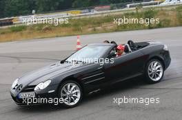 17.07.2008 Hockenheim, Germany,  Heikki Kovalainen (FIN), McLaren Mercedes and Lewis Hamilton (GBR), McLaren Mercedes driving McLaren Mercedes SLR's - Formula 1 World Championship, Rd 10, German Grand Prix, Thursday