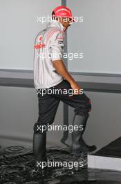 17.07.2008 Hockenheim, Germany,  Lewis Hamilton (GBR), McLaren Mercedes wearing wellies - Formula 1 World Championship, Rd 10, German Grand Prix, Thursday